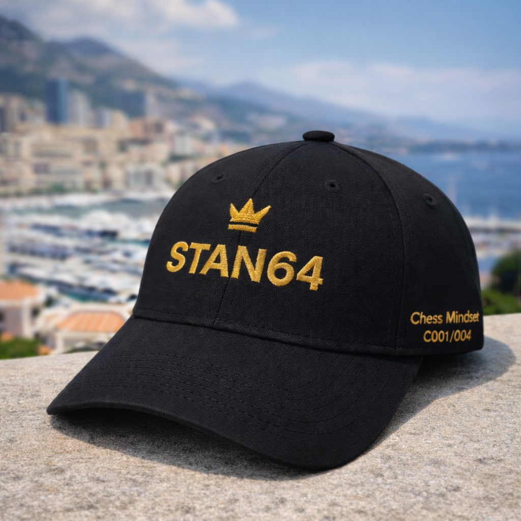 STAN64 C001 black cap with gold crown, photographed in Monaco